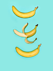 Image showing The group of bananas against blue background