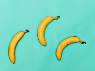 Image showing The group of bananas against blue background