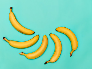 Image showing The group of bananas against blue background