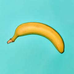 Image showing Single banana against blue background