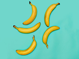 Image showing The group of bananas against blue background