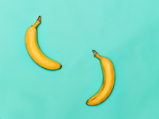 Image showing The two bananas against blue background