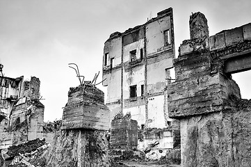 Image showing Pieces of Metal and Stone are Crumbling from Demolished Building