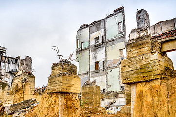 Image showing Pieces of Metal and Stone are Crumbling from Demolished Building