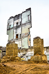 Image showing Pieces of Metal and Stone are Crumbling from Demolished Building