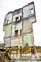 Image showing Pieces of Metal and Stone are Crumbling from Demolished Building