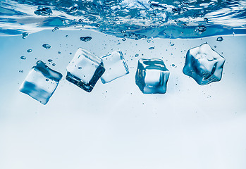 Image showing Ice cubes falling under water