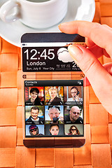 Image showing Smartphone with transparent screen in human hands.