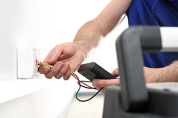 Image showing Electrician Installing Internet