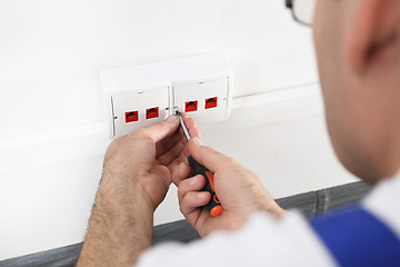 Image showing Electrician Installing Internet