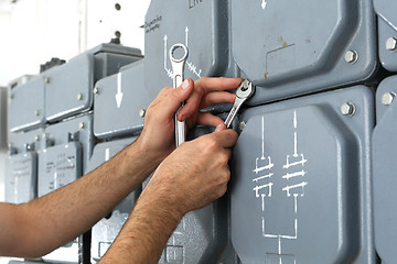 Image showing Switching current home. Corks, electrical switches on the dashboard plugs.