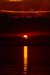 Image showing Sunrise in the sea with soft wave and cloudy