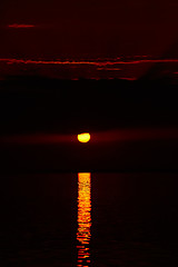 Image showing Sunrise in the sea with soft wave and cloudy