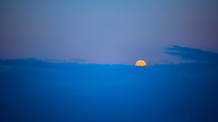 Image showing Full moon at sunset