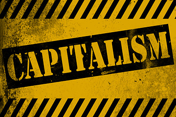 Image showing Capitalism sign yellow with stripes