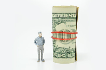 Image showing Figure of businessman and one dollar bill