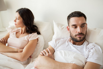 Image showing unhappy couple having conflict in bed at home