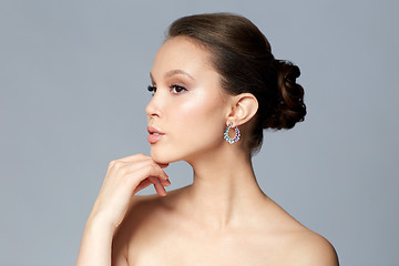 Image showing close up of beautiful woman face with earring