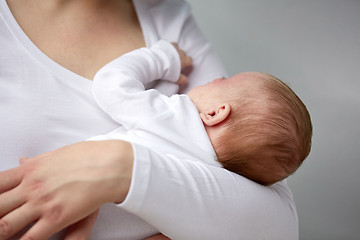 Image showing close up of mother holding newborn baby