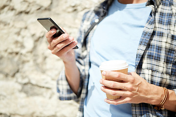 Image showing man with smartphone and coffee on city street