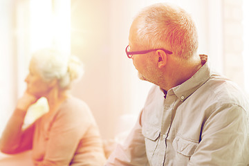 Image showing senior couple sitting on sofa at home