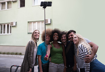 Image showing Group of friends taking picture of themselves