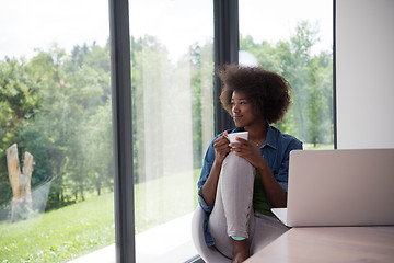 Image showing African American woman in the living room