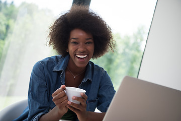 Image showing African American woman in the living room