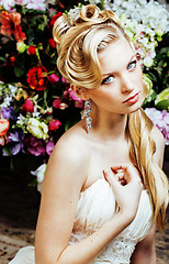 Image showing beauty young woman bride alone in luxury vintage interior with a lot of flowers close up