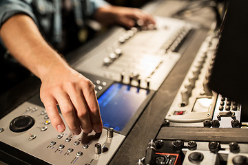 Image showing man using mixing console in music recording studio