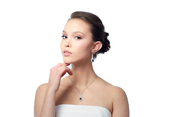 Image showing beautiful asian woman with earring and pendant