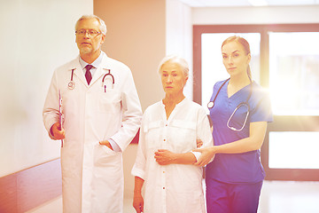 Image showing medics and senior patient woman at hospital