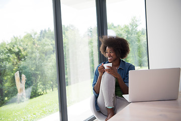 Image showing African American woman in the living room