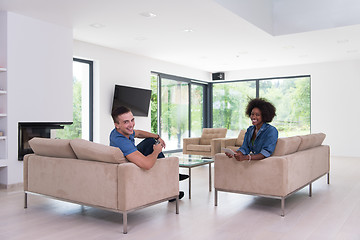 Image showing multiethnic couple in living room