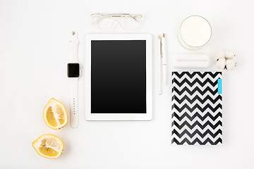 Image showing Top view of whitepink pastel office table. Flat lay image.