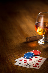 Image showing Cigar, chips for gamblings, drink and playing cards