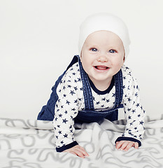 Image showing little cute baby toddler on carpet isolated close up smiling ado