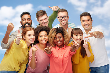 Image showing international group of people showing thumbs up