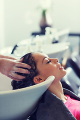 Image showing happy young woman at hair salon