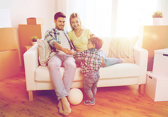 Image showing happy family moving to new home and playing ball