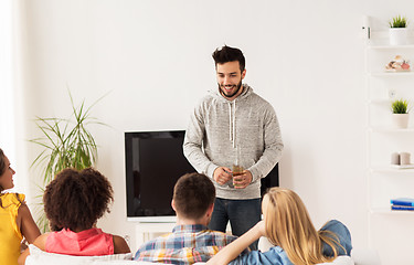 Image showing group of happy friends talking at home