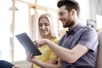 Image showing happy creative team with tablet pc in office