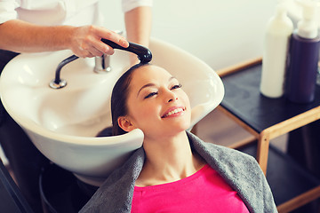 Image showing happy young woman at hair salon