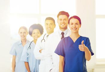 Image showing happy doctors showing thumbs up at hospital