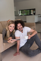 Image showing couple relaxing at  home with tablet computers