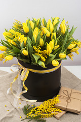 Image showing Bright spring bouquet of tulips and mimosa flowers