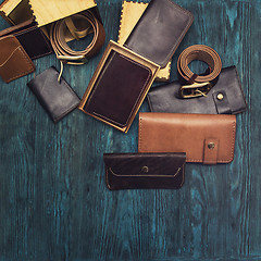 Image showing Men\'s accessories on a blue wooden