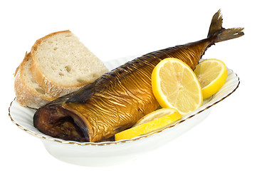 Image showing Smoked mackerel with lemon slice isolated