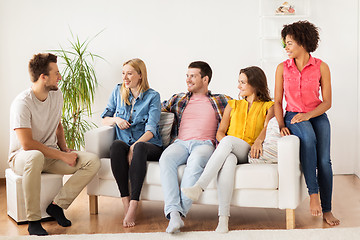 Image showing group of happy friends talking at home