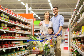 Image showing family with food in shopping cart at grocery store